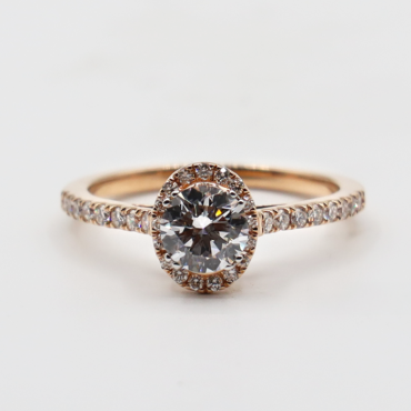 Round solitaire halo engagement rings