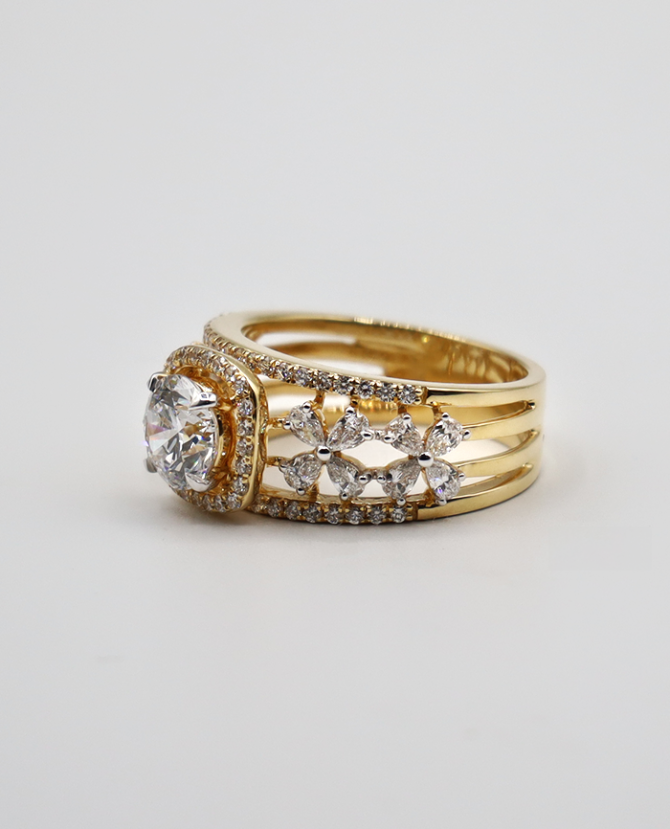 a gold ring with diamonds
